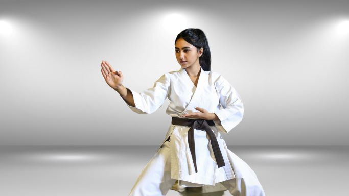 teenage girl practicing self-defense techniques